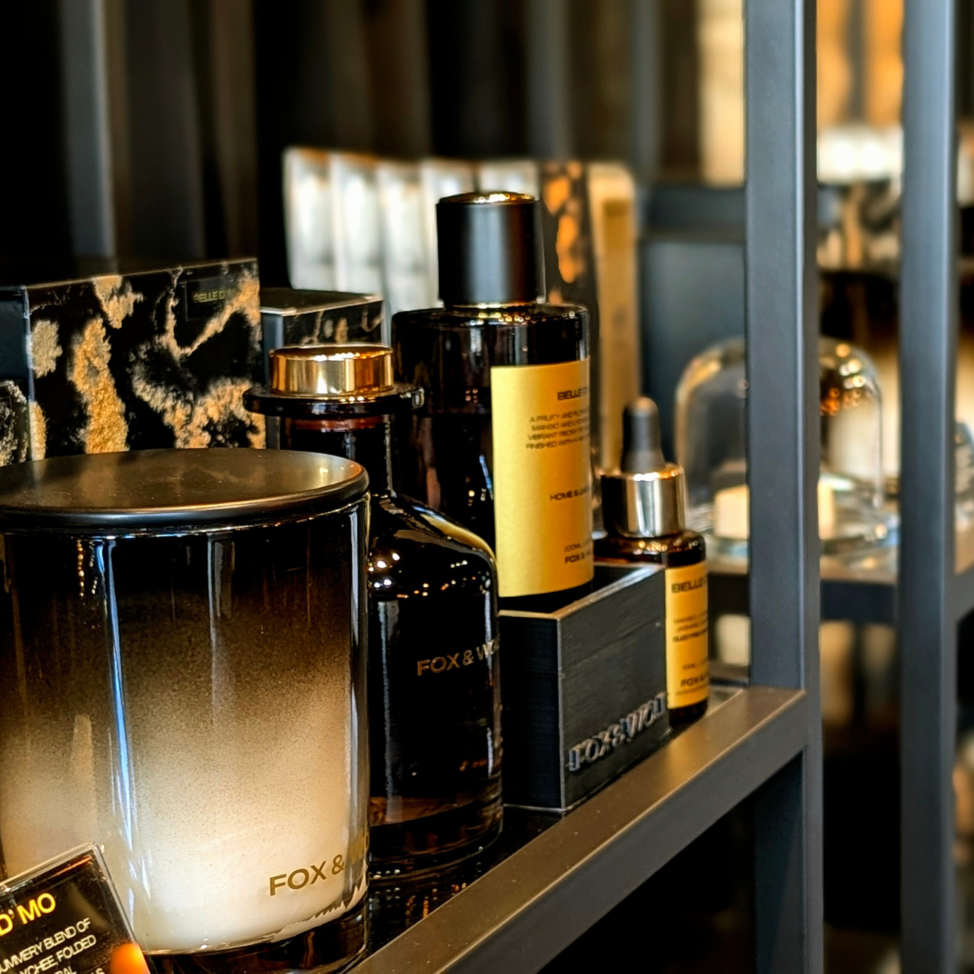 FOX and WOLF wholesale luxury hand-poured candles and reed diffusers displayed in boutique retail setting