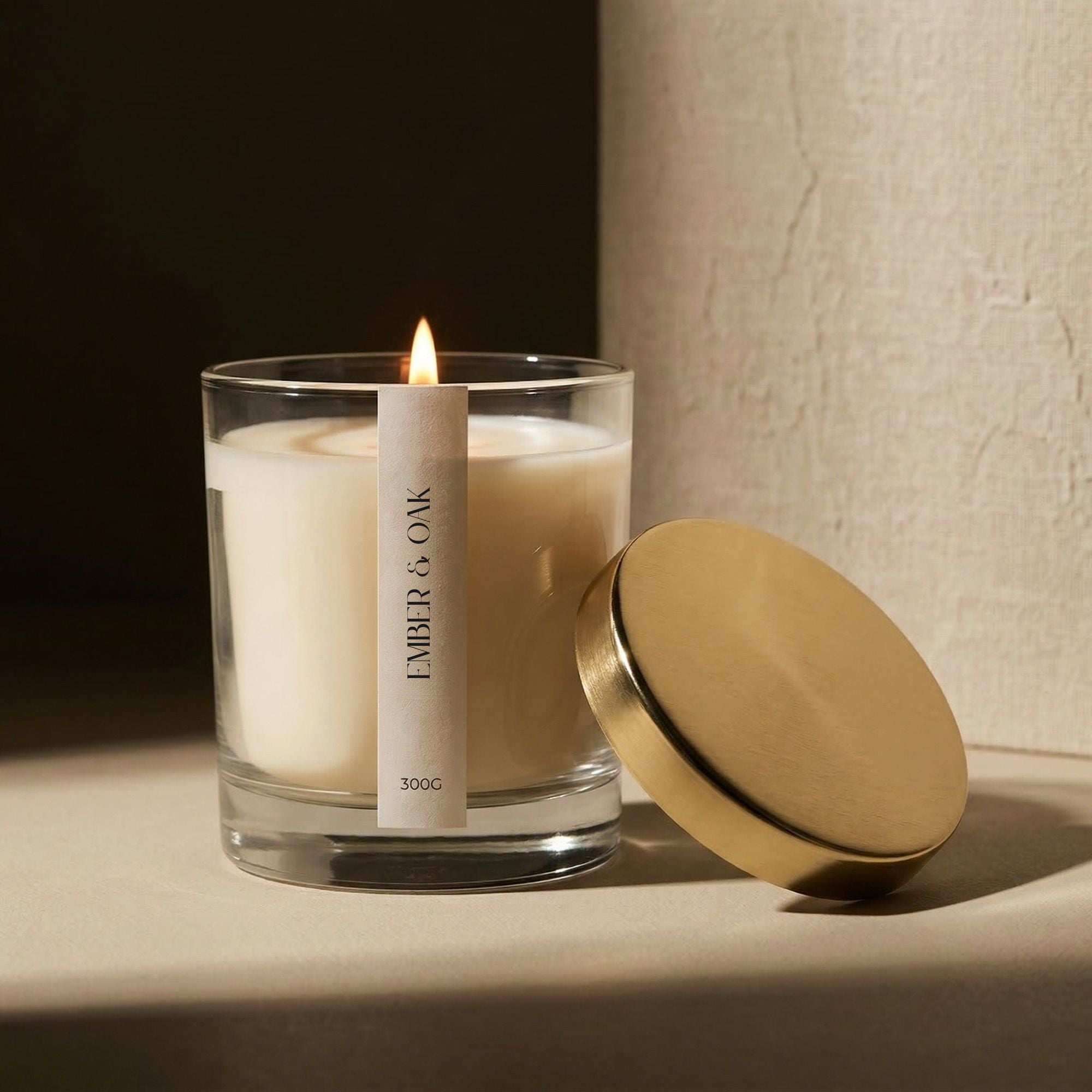 White label candle in clear glass tumbler with gold lid created for Ember and Oak by FOX and WOLF