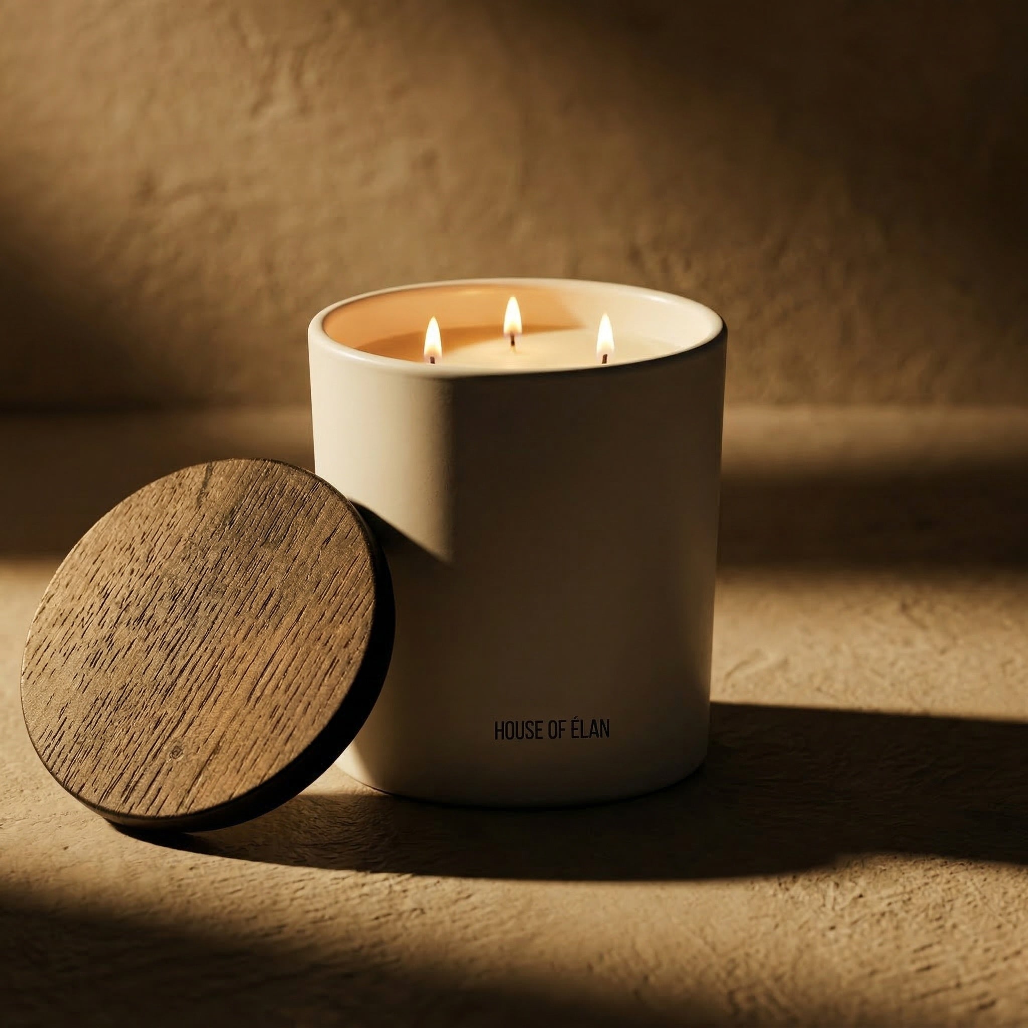 Custom white label candle in matte vessel with wooden lid created for House of Elan