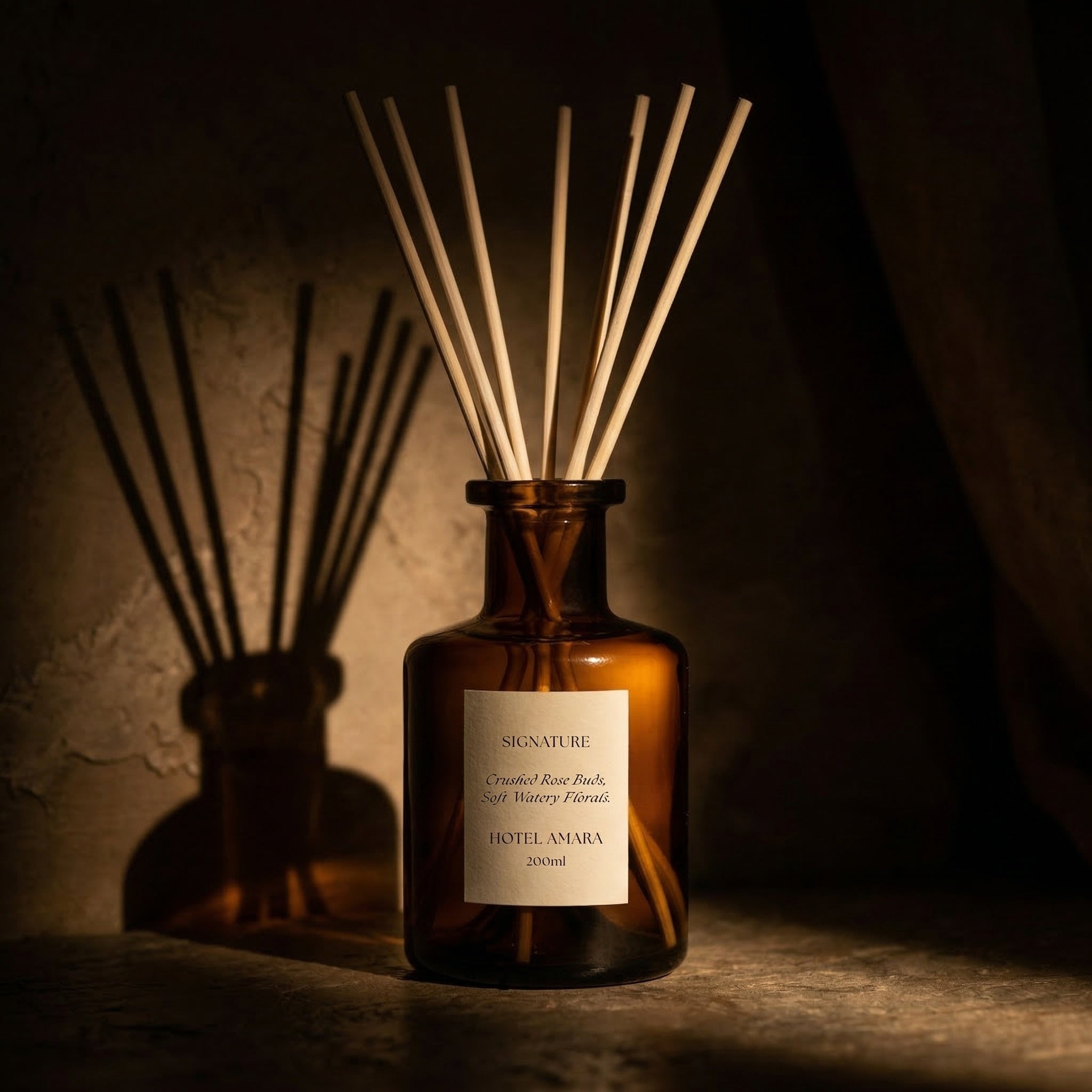 Custom white label reed diffuser in amber glass created for a hotel signature scent by FOX and WOLF