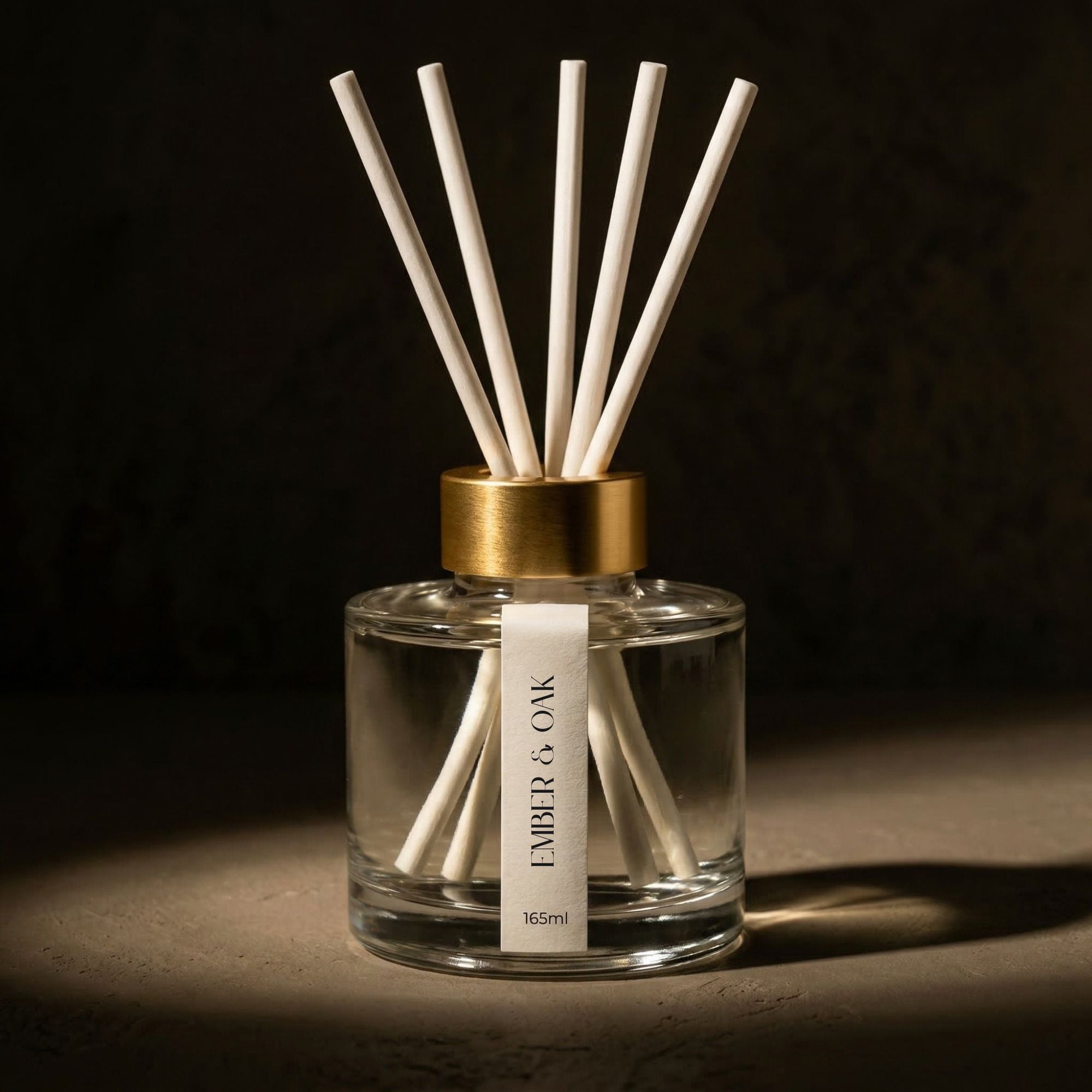 White label reed diffuser in clear glass with gold collar designed for retail by FOX and WOLF